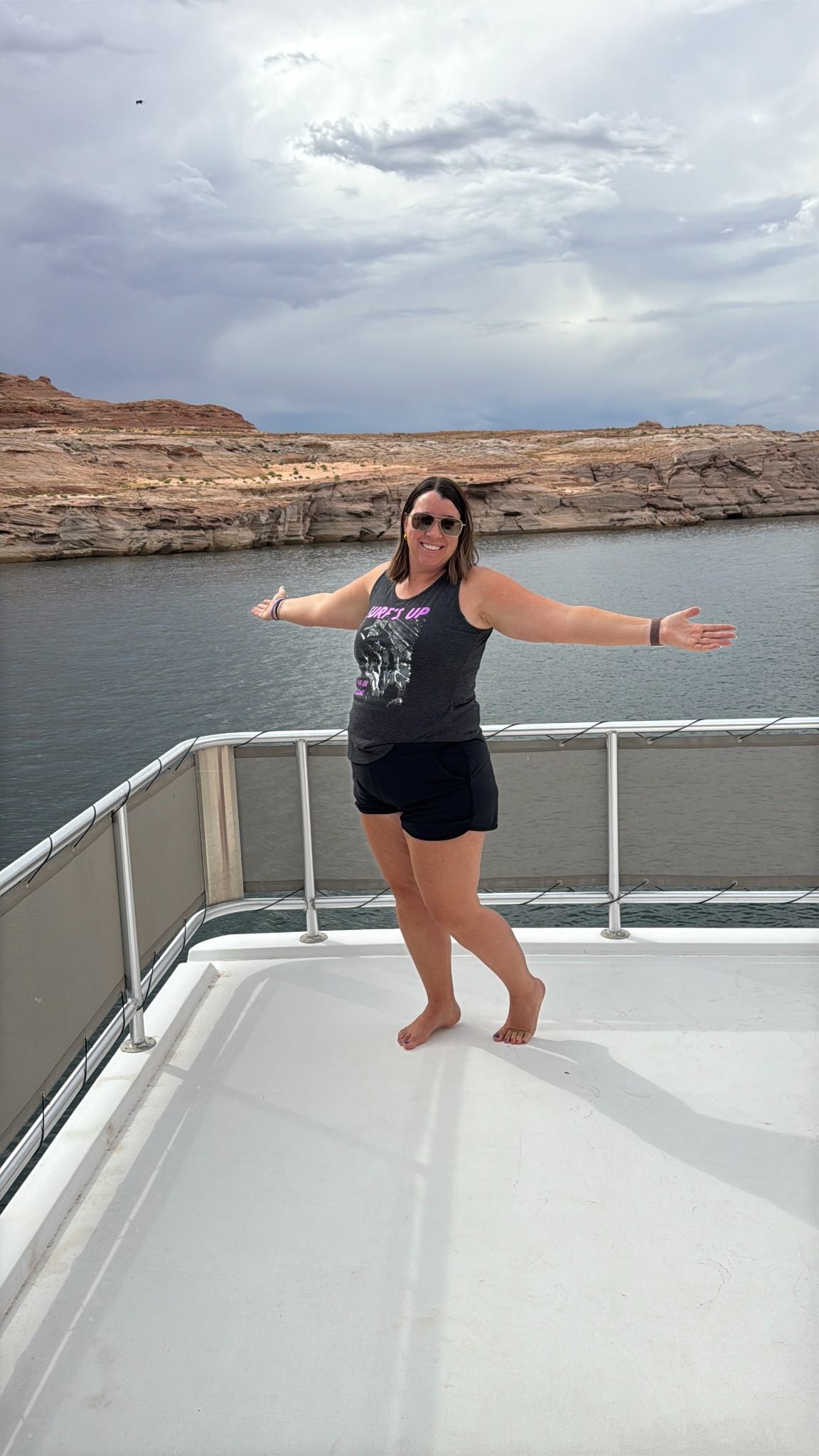 Aubrey smiling on a boat at Lake Powell